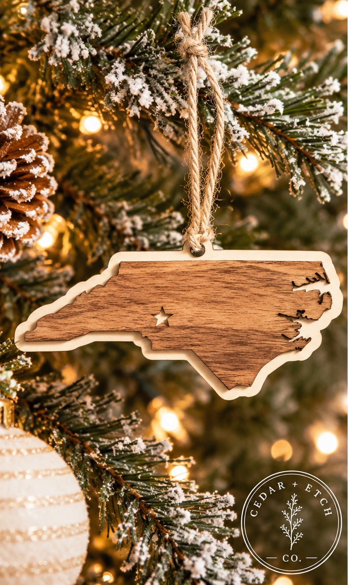 North Carolina layered wood ornament hanging on a Christmas tree