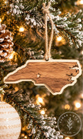 North Carolina layered wood ornament hanging on a Christmas tree